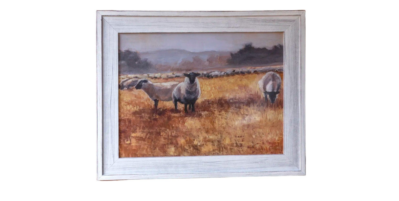 Sheep Grazing At Sunset Framed Print